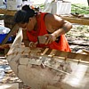 Carving a canoe by hand