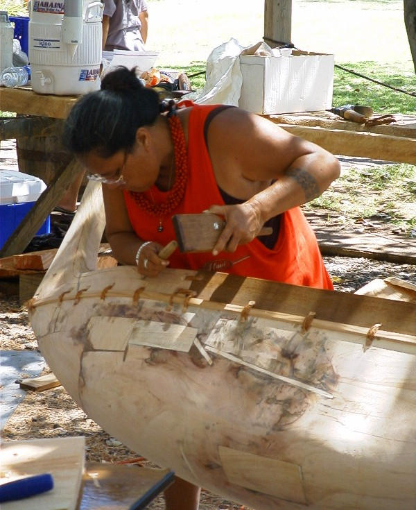 Carving a canoe by hand